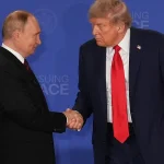 US President Trump shakes hands with Russian President Putin at a peace summit