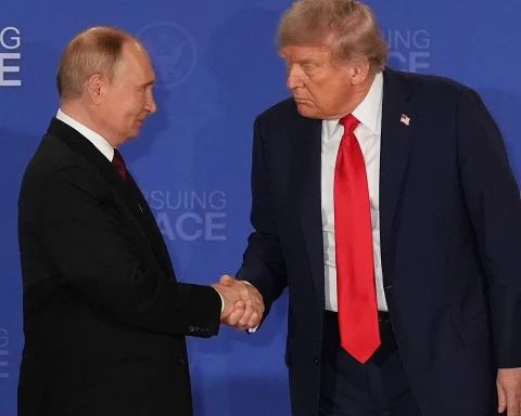 US President Trump shakes hands with Russian President Putin at a peace summit
